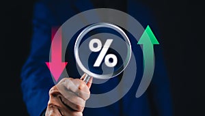 Executive analyzes financial data with a magnifying glass and charts.