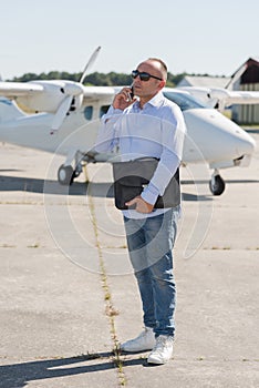 Executive business man in front private jet