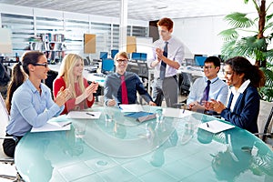 Executive business team clapping hands meeting