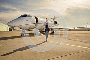 A executive business woman leaving a plane