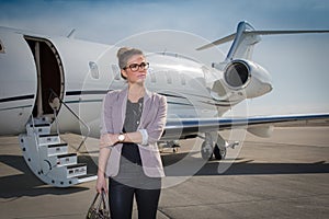 A executive business woman leaving a plane