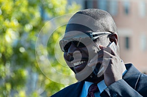 Executive on Cell Phone Wearing Sunglasses