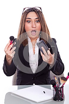 Executive desk with makeup brushes