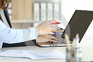 Executive hands working online with a laptop at office