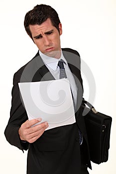 Executive looking through report