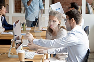 Executive manager teaching employee showing online project pointing on computer