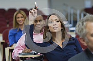 Executive Raises Hand During A Lecture