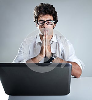 Executive thinking in front of his laptop