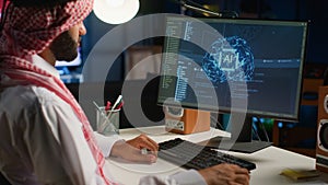 Man in personal office writes AI code