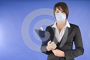 Executive woman with protective mask for swine flu