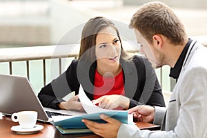 Executives having a business conversation in a bar photo