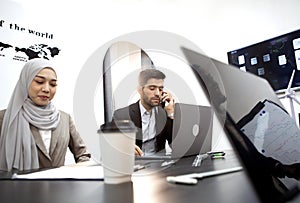 Executives hold team meetings via computers