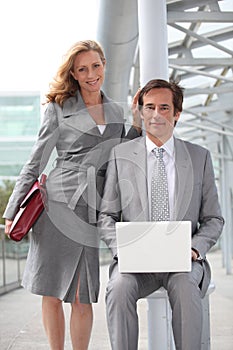 Executives with laptop computer