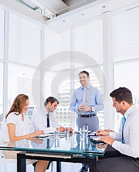 Executives sitting around conference table