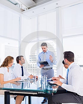 Executives sitting around conference table