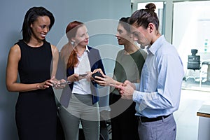 Executives using mobile phone in the office