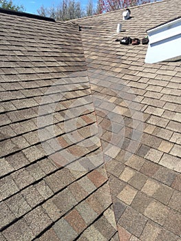 Exemplary Roof leak repairs on valley of residential shingle roof; roofing