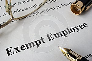 Exempt employee concept written on paper.