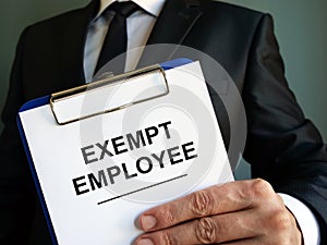 Exempt employee sign is in the hand