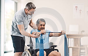 This exercise is also great for maintaining good balance. Shot of a senior man in a wheelchair exercising with a