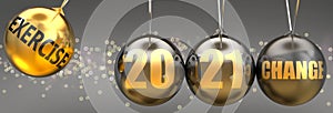 Exercise as a driving force of change in the new year 2021 - pictured as a swinging sphere with phrase Exercise giving momentum to