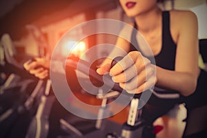 Exercise bike cardio workout at fitness gym