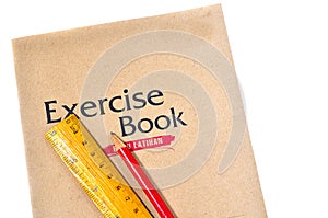 Exercise book with ruler and pencil