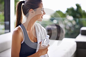 Exercise, bottle and happy woman with water to drink, health and hydration for gym, training and workout. Activewear