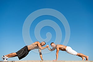 Daily exercise concept. Push ups challenge. Men motivated workout outdoors. Improve endurance by push ups. Men shirtless