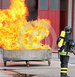 Exercise of Firefighters with a tank full of flames and very hot
