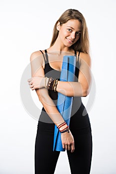 Exercise fitness woman ready for workout standing holding yoga mat isolated on white background. Sporty fit beautiful