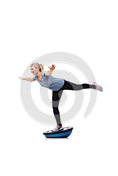 Exercise, half ball and woman balance for wellness challenge, studio workout or legs strength performance. Gym equipment