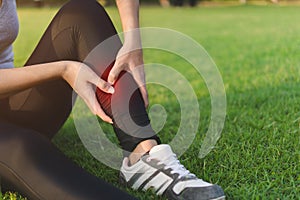 Exercise and healthy concept, Young woman asian have accident leg twist sprain in sport exercise jogging, Selective focus