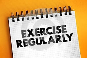 Exercise Regularly text on notepad, concept background