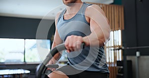 Exercise, spinning and body of man in gym for training, intense workout and fitness for health. Sports, cardio machine