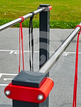 Exercise and stretching rubber elastic bands hanging on a workout rail photo