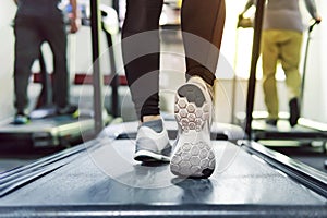 Exercise treadmill cardio running workout at fitness gym of woman taking weight loss with machine aerobic for slim and firm health