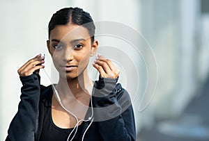 Exercise, woman and listening to music outdoors for portrait from distraction by training, workout and fitness for photo