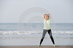 Exercise woman smiling at the beach
