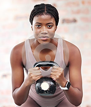 Exercise, workout and black woman with kettle ball for strength, health or wellness. Sports, fitness and face portrait