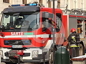 Exercises fire brigade in the old part of the city in the winter. Elimination of fire and natural disasters. Emergency response se