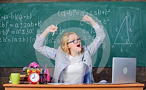 Exercises to maintain vivacity. Teacher woman sit table classroom chalkboard background. Work far beyond actual school