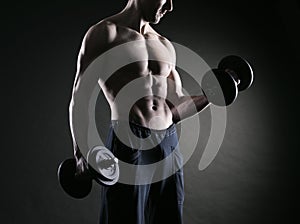 Exercising biceps with dumbbells