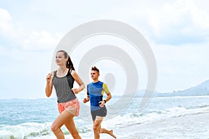 Exercising. Happy Couple Running On Beach. Sports, Fitness. Heal