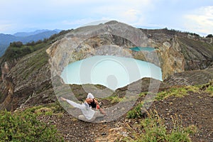 Exercising yoga on volcano photo