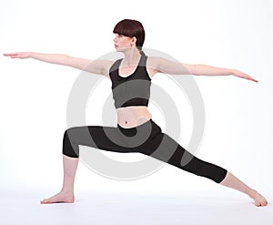 Exercising Yoga Warrior Two pose Virabhadrasana