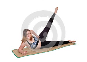 Exercising young woman lying on the floor