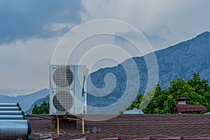 Exhaust air fan on the roof of the house