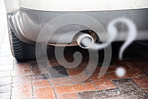 Exhaust from a car with diesel engine emitting gas in the shape