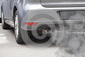 Exhaust pipe of a car blowing out the pollution from the back of a car